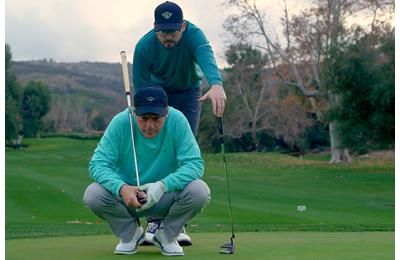 Sean Toulon and his Son, Preston, line up a putt with their new 2024 First Run Toulon Golf putter collection