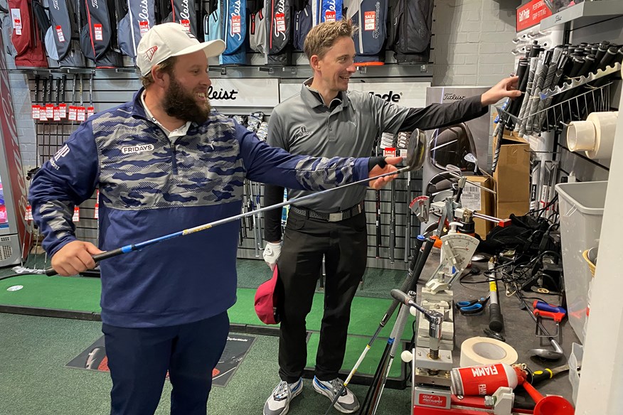 No left-handed clubs here! John Robins and Andrew 'Beef' Johnston in the North Middlesex Golf Club pro shop.